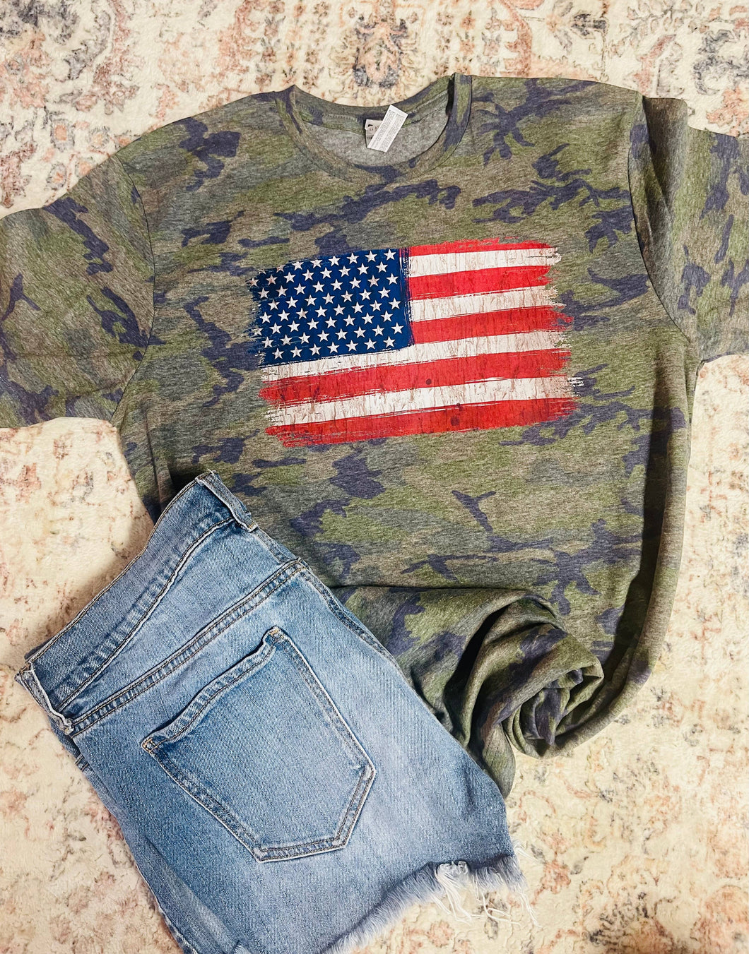 Distressed flag on vintage camo Tee